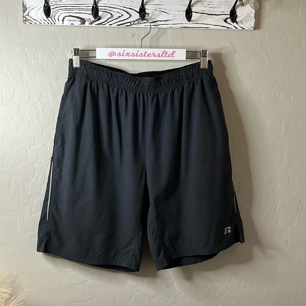 Russell Brand, men’s athletic shorts reflective tape on sides front pockets. MED